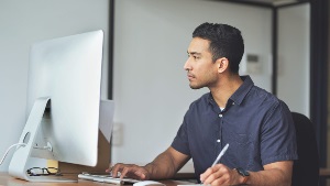 man using desktop computer